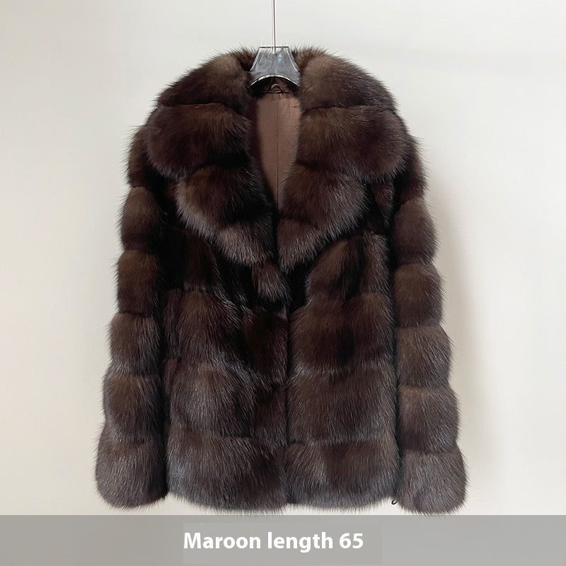 Brown fur coat on a hanger 