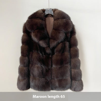Brown fur coat on a hanger 