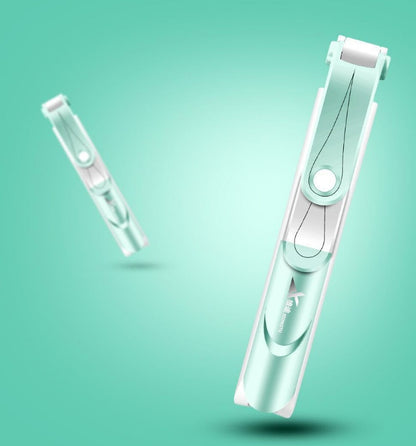 White hair removal device on a teal background