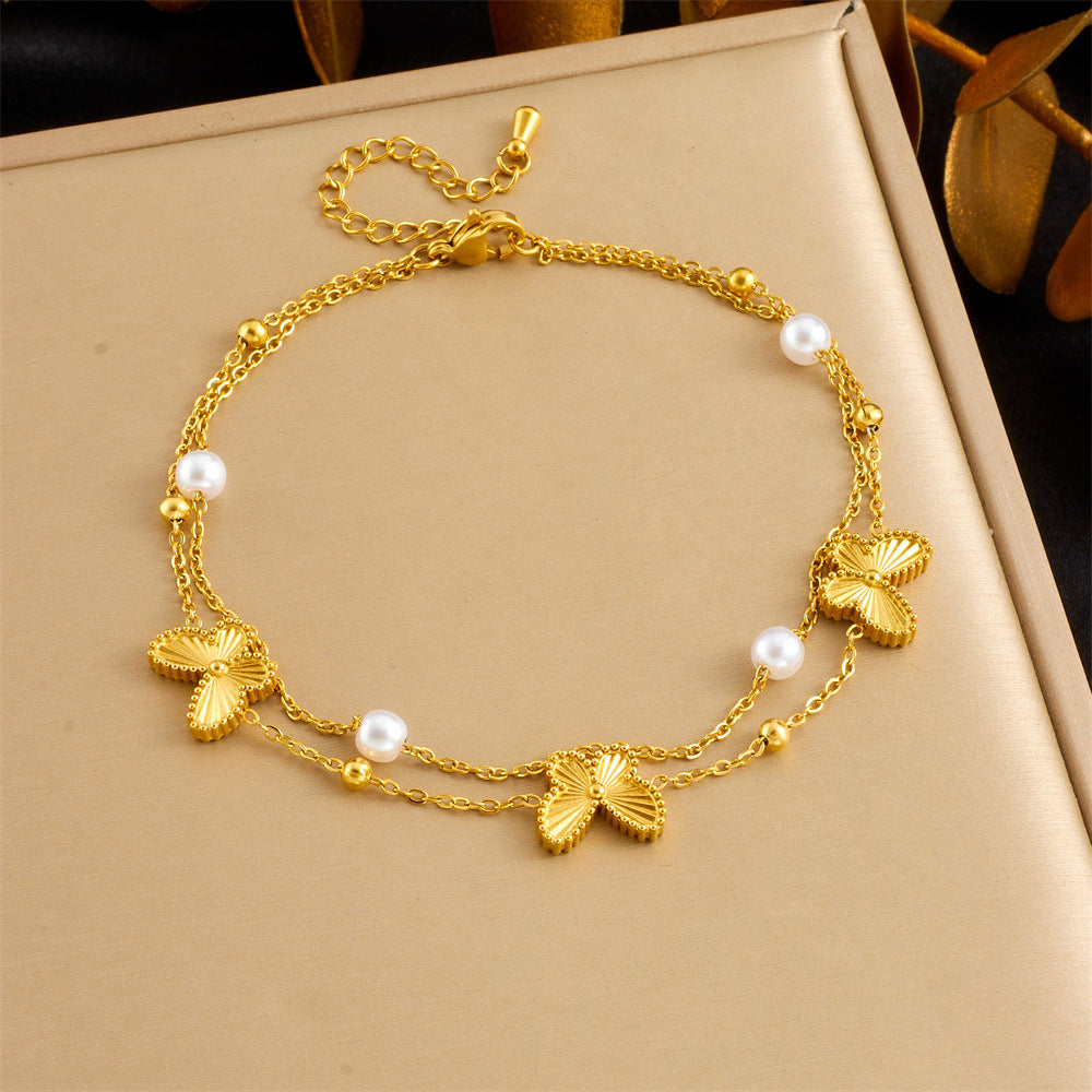 Gold-tone anklet with shell charms and pearl beads with adjustable clasp