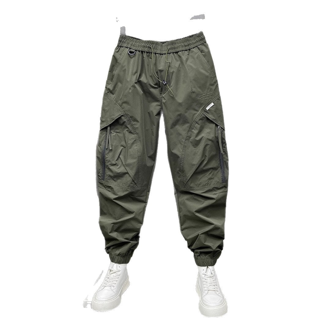 Men's tapered cropped pants, army green, front view with drawstring and cargo pockets