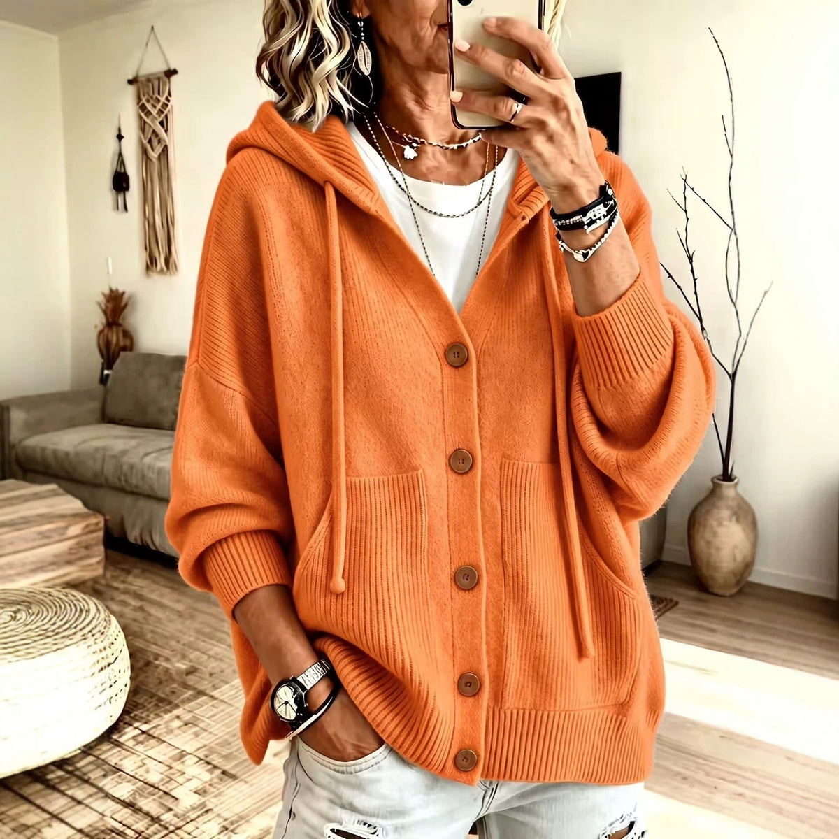 Orange button-knit hooded cardigan with front buttons and kangaroo pocket