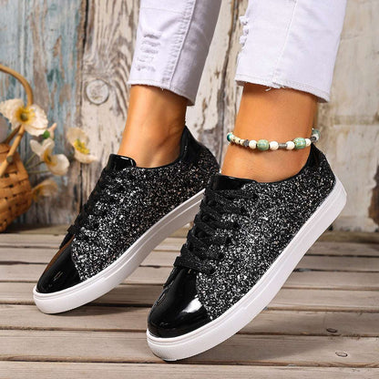 Black sequin lace-up board shoes with white rubber sole, low profile.