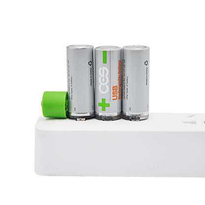 Three cylindrical batteries with a green battery on a white surface