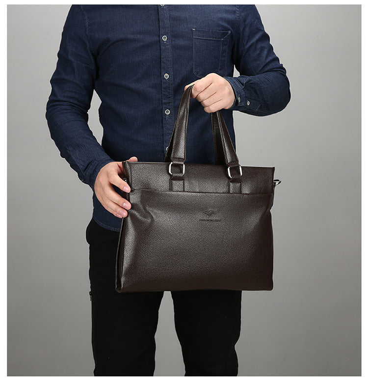 Black leather-style briefcase with dual top handles, held by a man