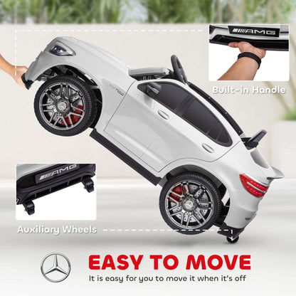 White kids 12V ride-on SUV with built-in handle and auxiliary wheels detail