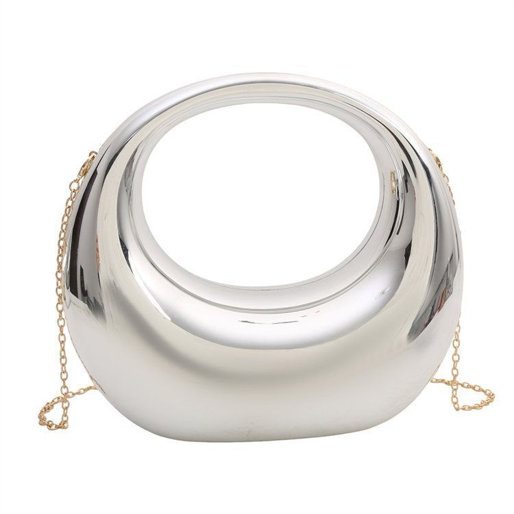 Silver half-moon acrylic crossbody bag with chain strap and reflective curved shell