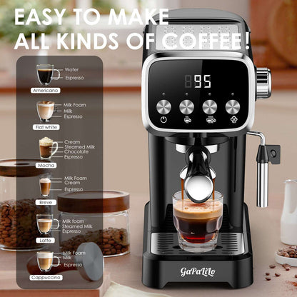 Compact espresso machine in black and silver with steam wand over a glass of espresso