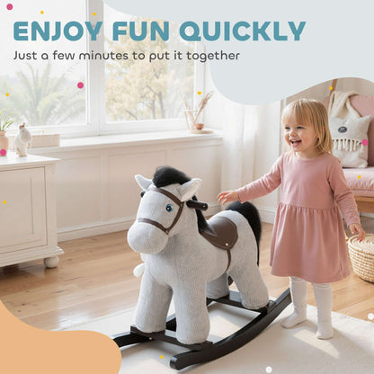 Gray plush rocking horse ride-on toy with rabbit accessory, child holding reins