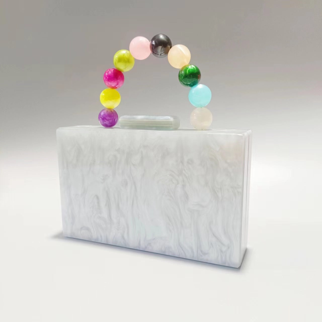 Women's acrylic evening bag with clear white body and multicolor pearl beaded handle