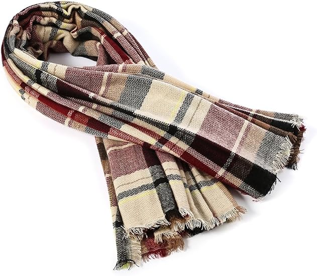 Plaid scarf with multicolor bands and fringed ends, laid in a loose roll