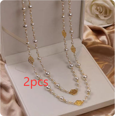 2-pack multi-layer pearl necklaces with gold-tone floral charms and round pearl beads