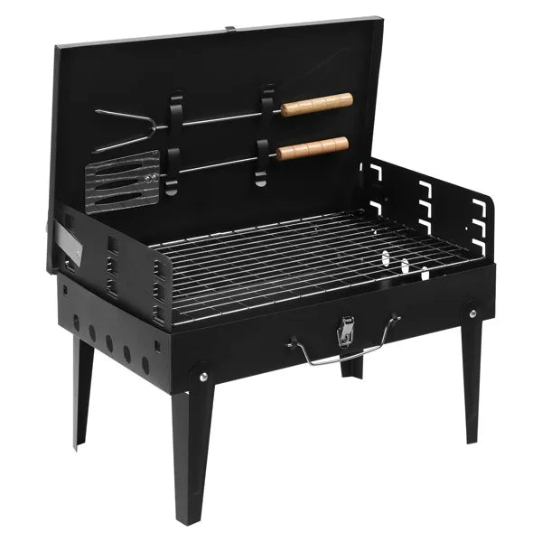Black square charcoal grill with open lid, cooking grate, and side rack supports