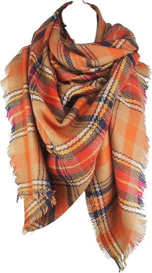 Women's plaid blanket scarf in orange and tan with black accents, fringed ends