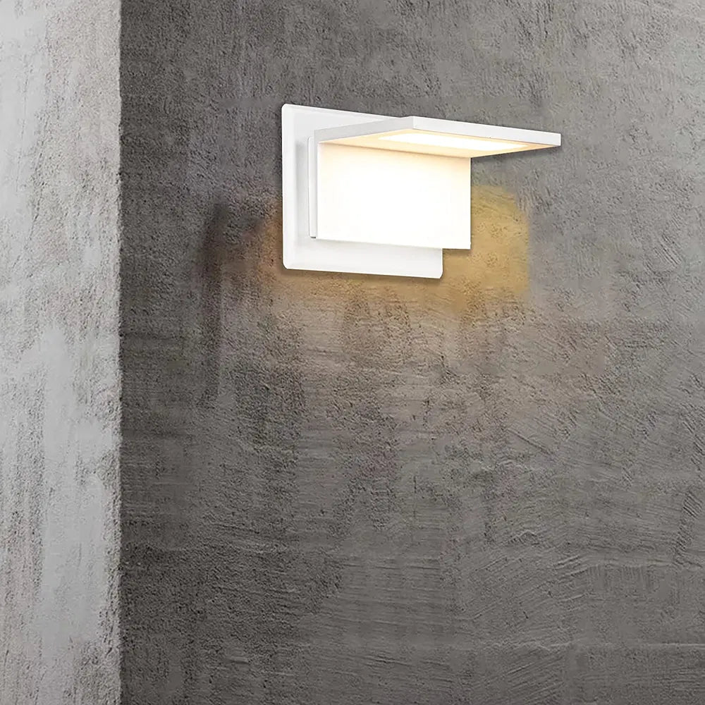 White modern outdoor wall sconce with rectangular frosted diffuser and soft LED glow