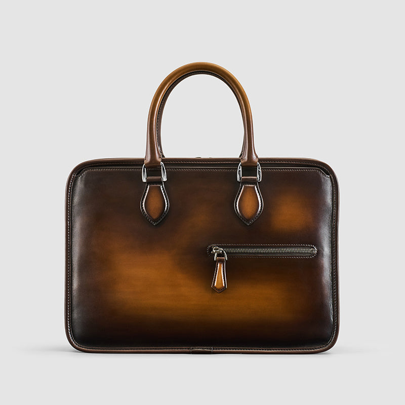 Men's vintage leather business bag in tobacco brown with tan handles and front zip pocket
