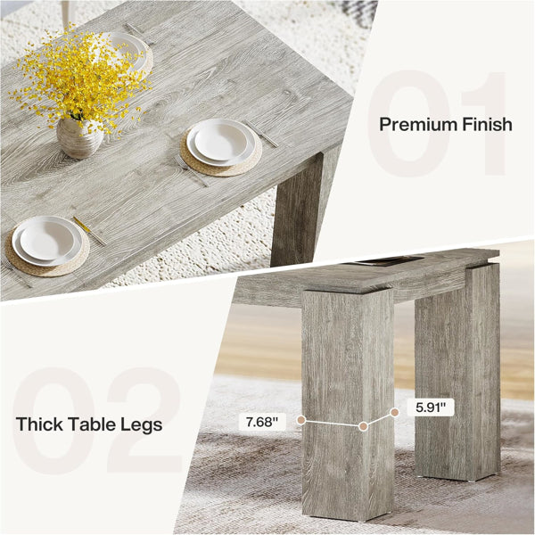 Rectangular dining table with thick legs and gray wood grain top, close-up view