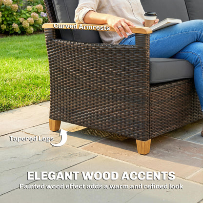 Dark wicker outdoor sofa armrest with gray cushion and wood feet
