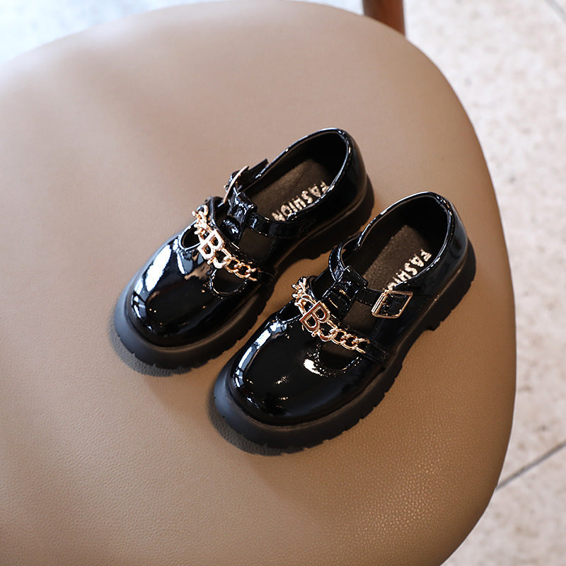 Children's black patent Mary Jane shoes with gold chain buckle strap and thick sole