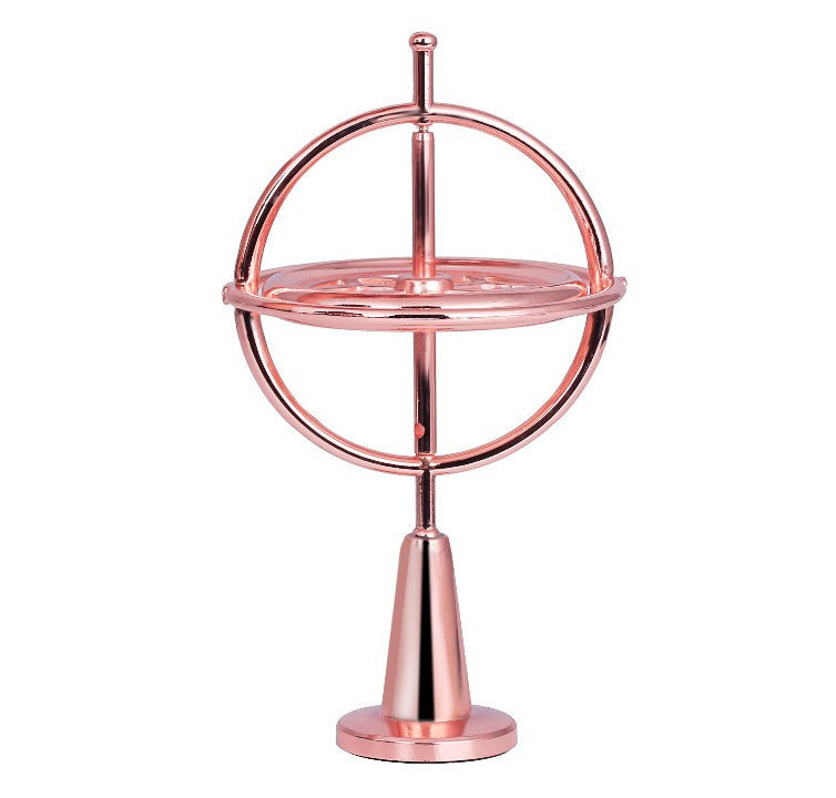 Rose gold self-balancing finger gyroscope with circular frame