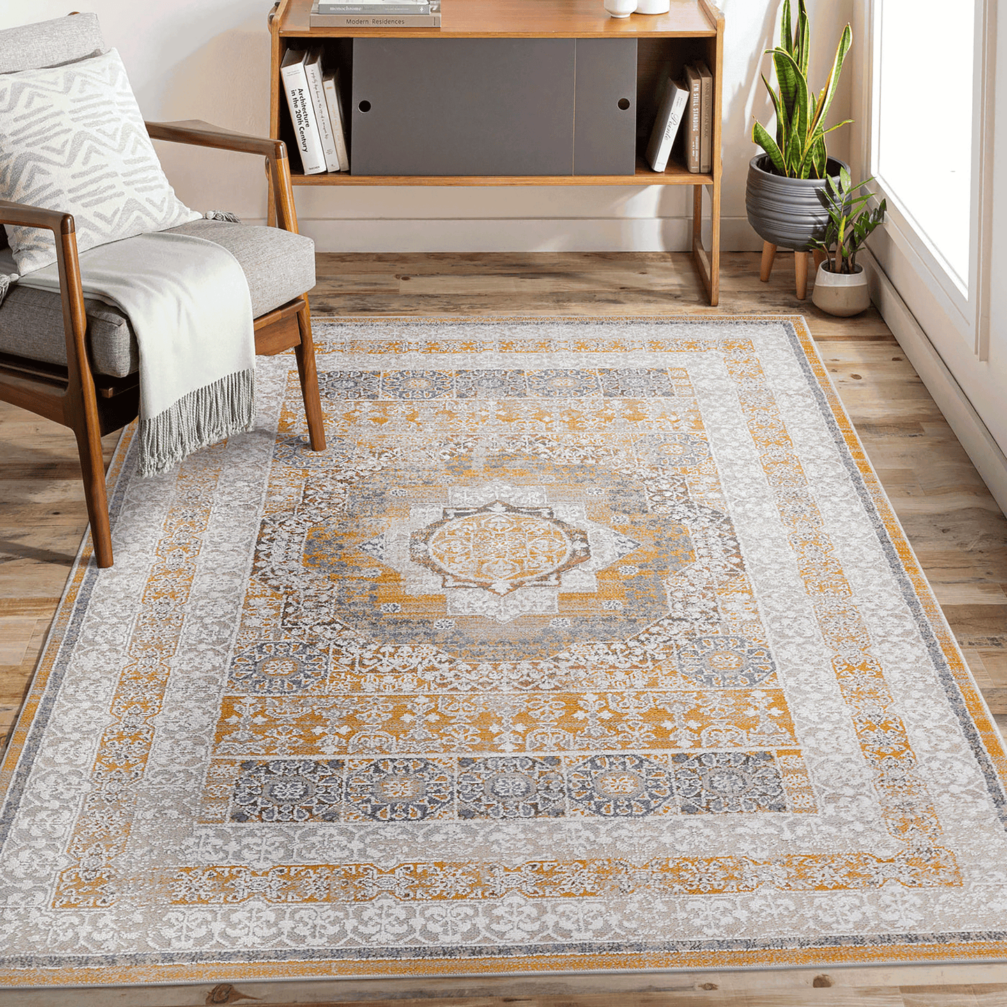 Rectangular cream-and-ivory area rug with medallion center and ornate blue/orange border