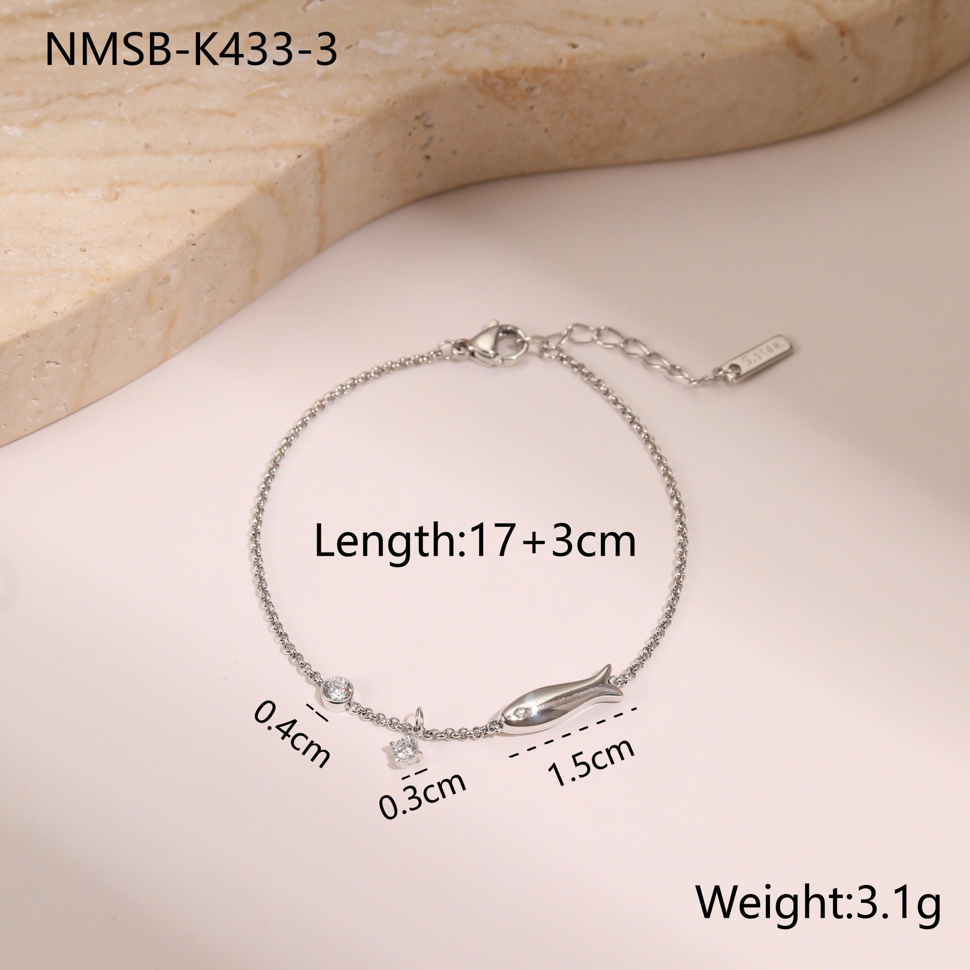 Silver-tone zircon charm bracelet with curved charm and small round stones