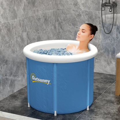 Blue portable cold plunge tub with white rim, with a person soaking in water