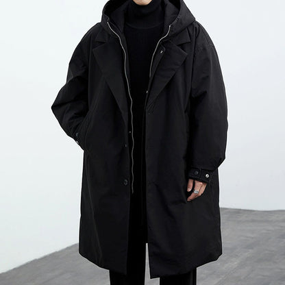 Black mid-length hooded trench coat with button front and layered shoulder panels