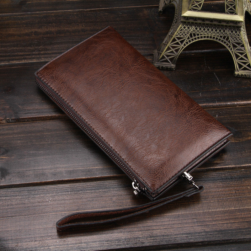 Dark brown leather long wallet with zipper and wrist strap, stitched edge