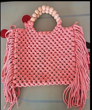 Woven mini crossbody bag with beaded handle, fringe tassels, pink crochet