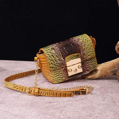 Olive-and-brown one-shoulder crossbody bag with crocodile texture, gold-tone clasp and chain strap.
