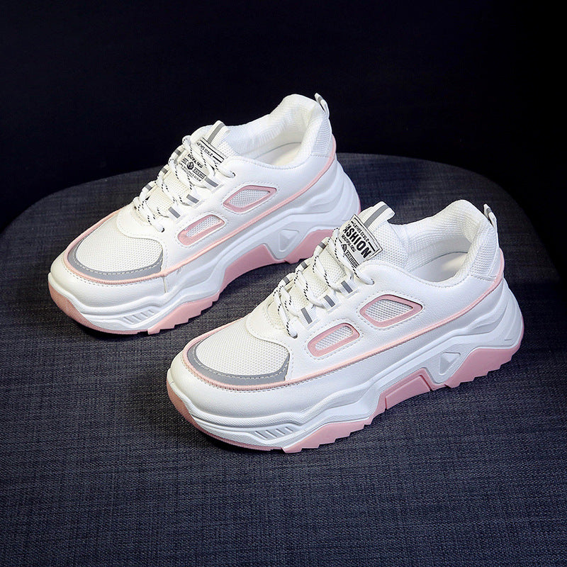 Platform sneakers, white upper with pink trim, chunky sole and lace-up front