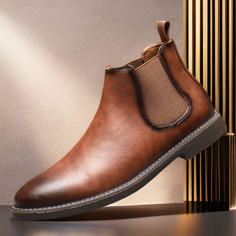Men's brown leather Chelsea boot with elastic side gore, pull tab, and stitched sole edge