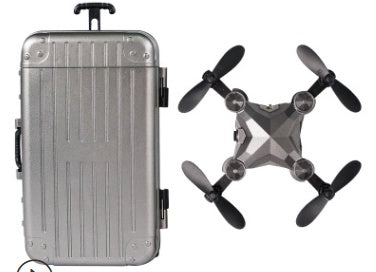 Silver mini drone suitcase with side handle and gray quadcopter