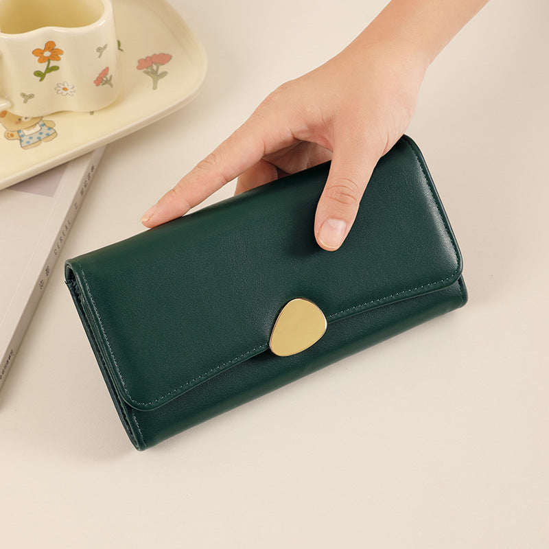 Dark green long wallet with card holder and heart-shaped snap clasp, slim foldover style