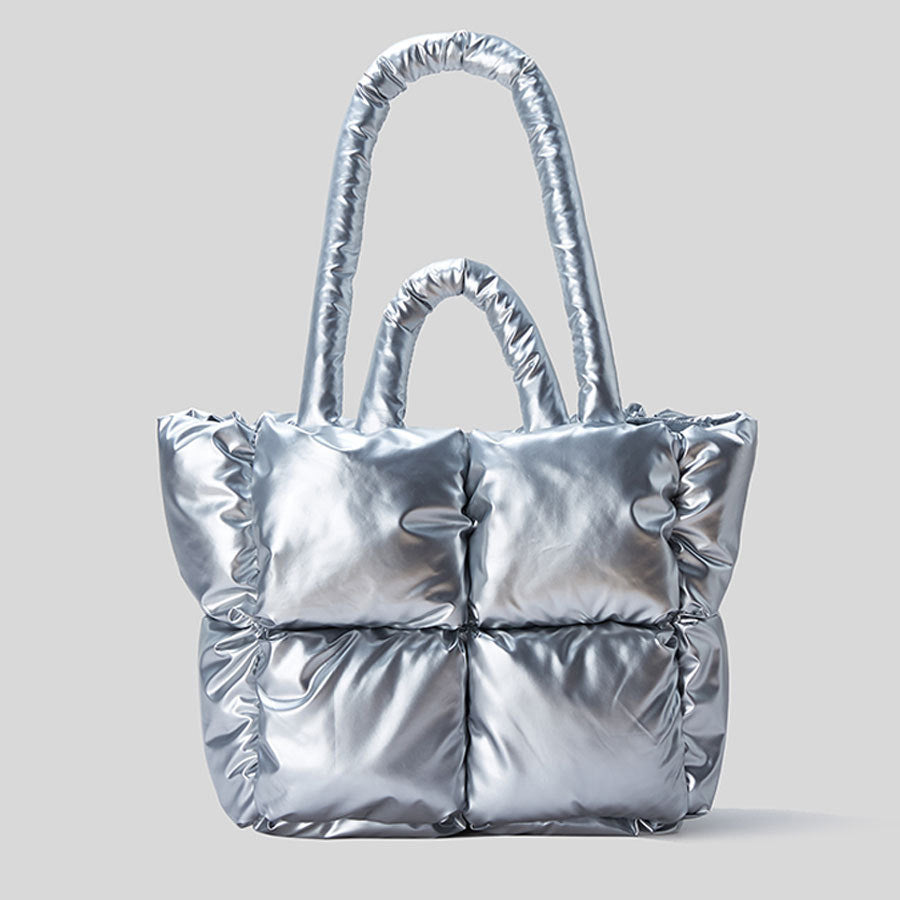 Silver puffy one-shoulder handbag with quilted panels and ruched side details