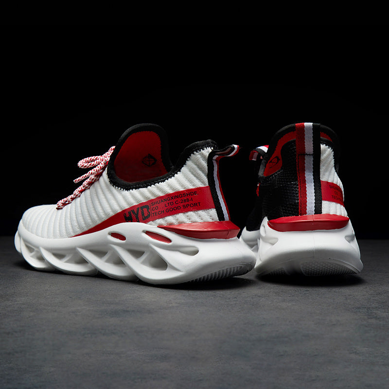 White knit sneaker with red laces, black-and-red striped collar, chunky white sole