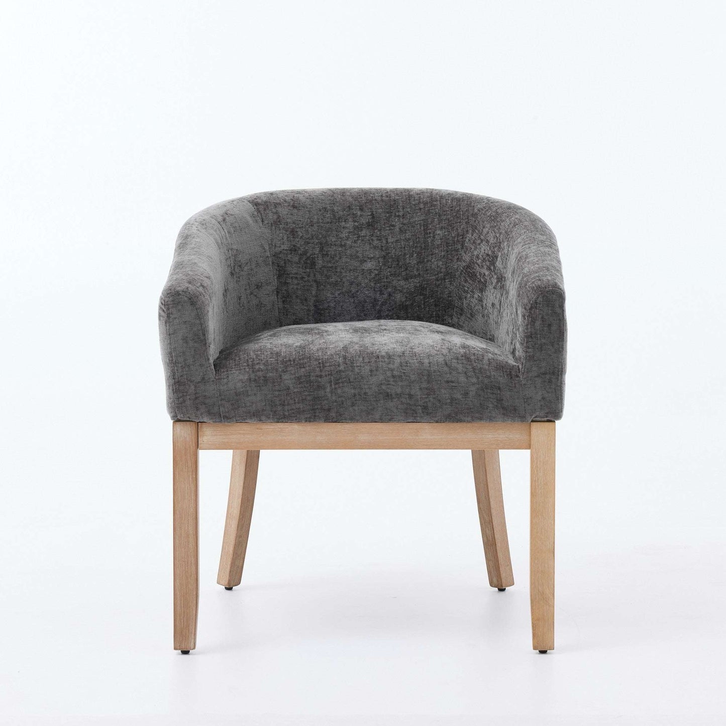 Gray chenille dining chair with rounded back and light hardwood frame