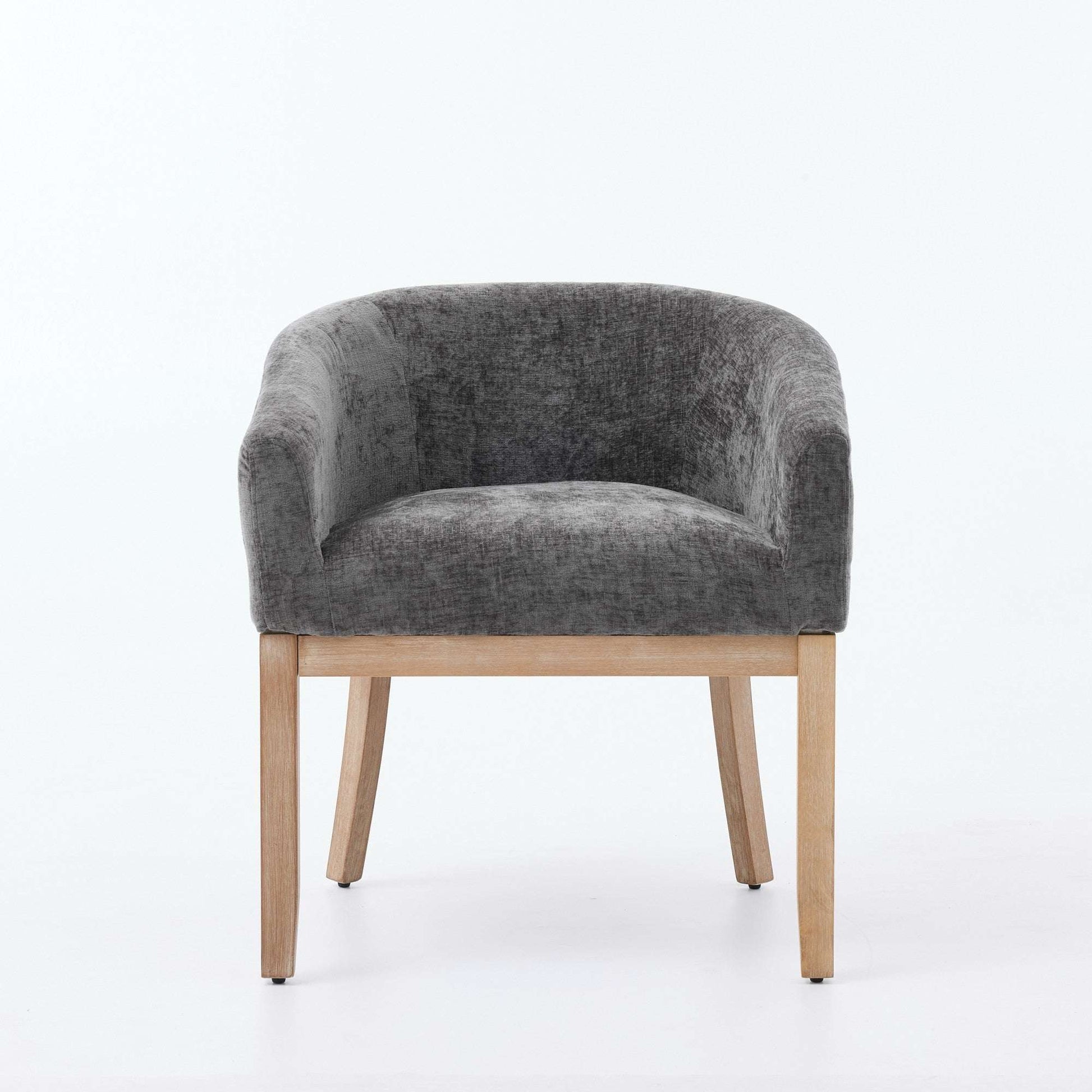 Gray chenille dining chair with rounded back and light hardwood frame