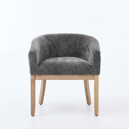 Gray chenille dining chair with rounded back and light hardwood frame