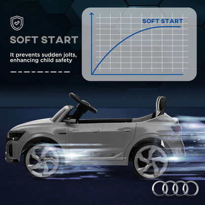Gray kids ride-on car side view with glowing light effects and spinning wheels