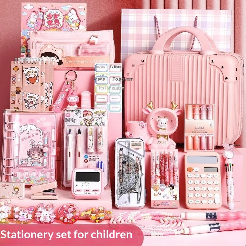 Pink stationery set with accessories in compartments, including notebook and pencil cases