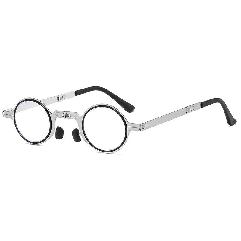 Folding reading glasses with silver metal frame and blue-tinted round lenses, side view
