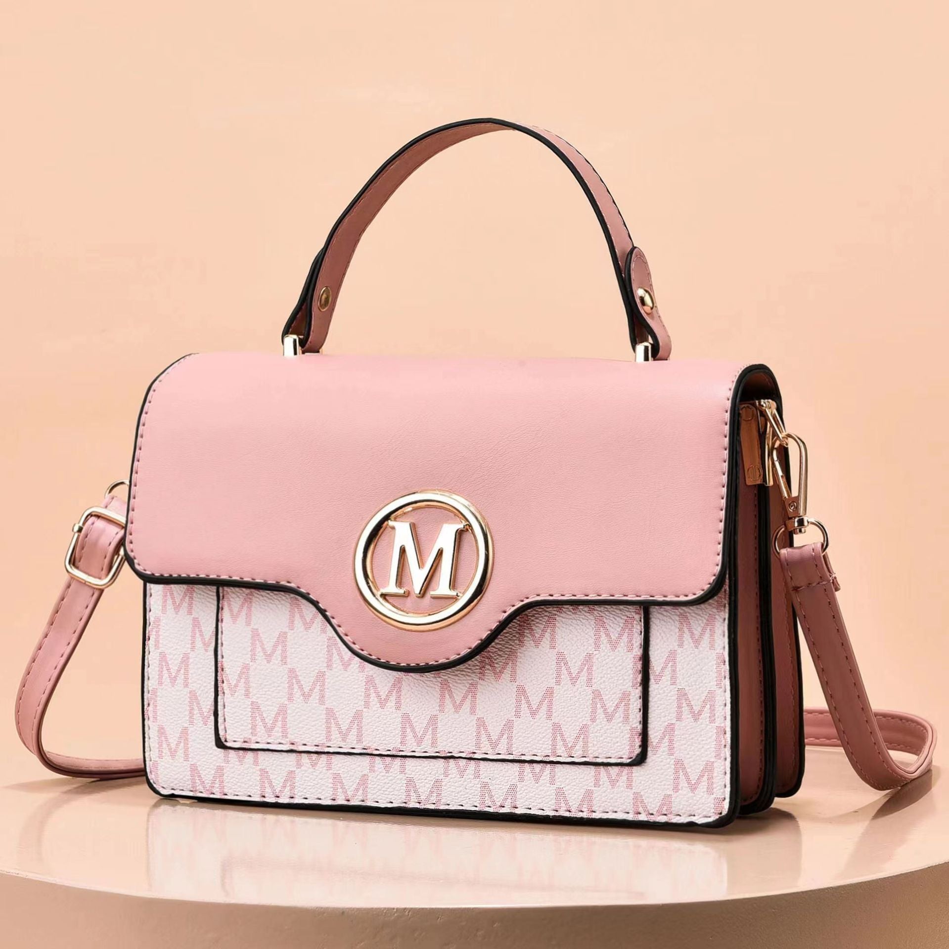 Light pink printed shoulder bag with M logo emblem and top handles