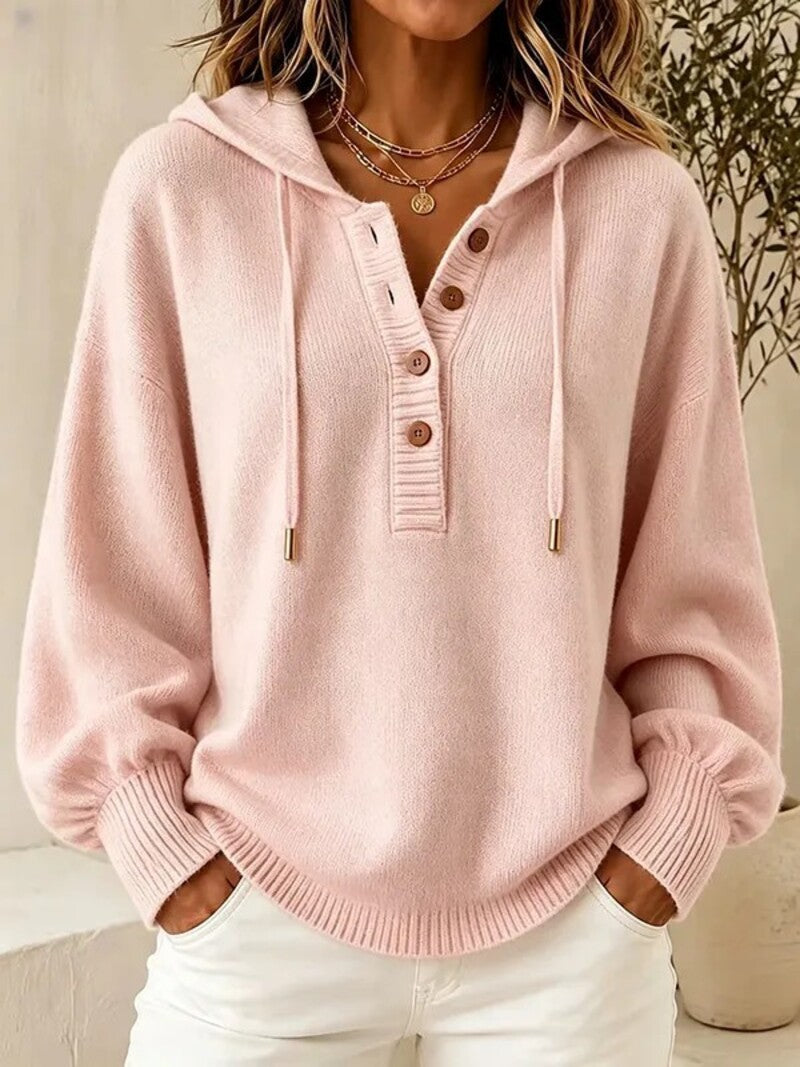 Pink hooded knit sweater with front buttons, drawstring, and ribbed cuffs and hem