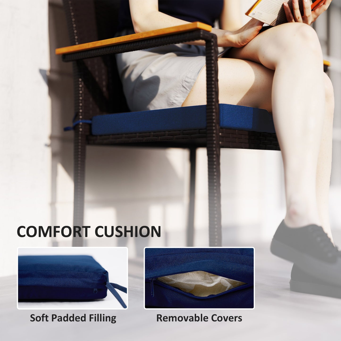 Patio chair cushion with blue removable cover on dark wicker armchair