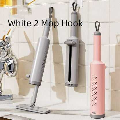 White 2 Mop Hook with mop attachments on a tiled wall.