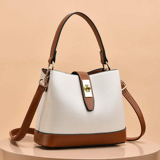 Two-tone tote handbag with shoulder strap and gold clasp, beige/white