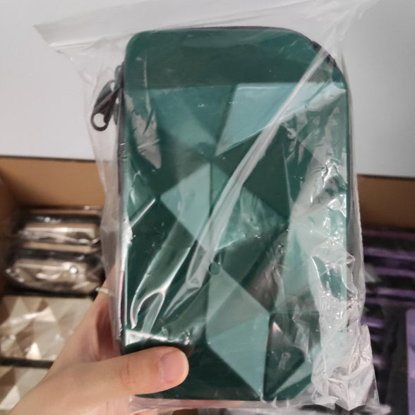 Plastic-wrapped geometric cosmetic bag, green, with zip and carry strap