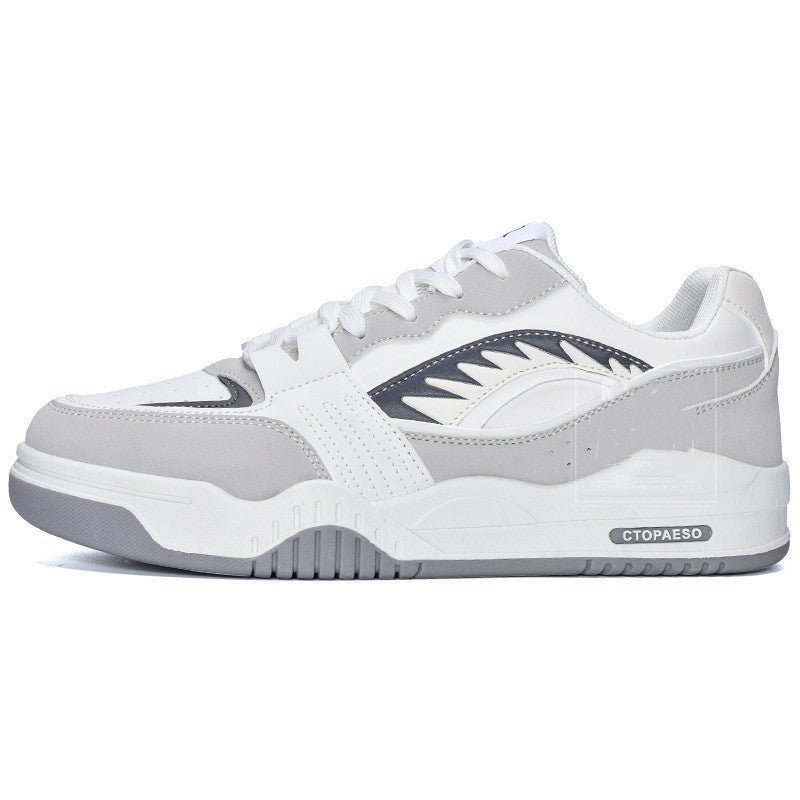 Women's low-top sneakers, white with navy logo detail and light gray sole.